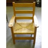 AN ARTS AND CRAFTS OAK LADDER BACK CHILD'S CHAIR BRUSH SEATED, LATE 20TH CENTURY