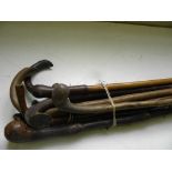 A SILVER MOUNTED MALACCA WALKING CANE, A BAMBOO CANE WITH STITCHED LEATHER GRIP AND VARIOUS OTHER