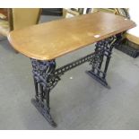 A VICTORIAN CAST IRON STRETCHER TABLE WITH A OBLONG MAHOGANY TOP