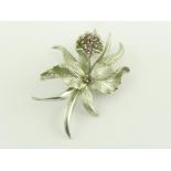 A RUBY AND WHITE GOLD ORCHID BROOCH, 10.3G