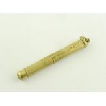 A 9CT GOLD TOOTHPICK, ENGINE TURNED, 5.5G