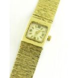A LONGINES 9CT GOLD LADY'S WRISTWATCH WITH BARK TEXTURED BRACELET, 33G GROSS
