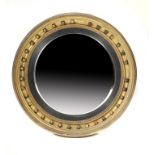 A REGENCY GILTWOOD CIRCULAR MIRROR, C1820 with convex plate, 64cm diam ++Originally with surmount