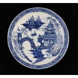 A CALCUT BLUE AND WHITE SAUCER DISH, C1794-96 printed with the Round Arched Bridge pattern, 18.5cm
