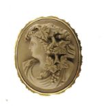 A LAVA CAMEO BROOCH, 19TH C carved with the head of a bacchante, in gold mount, marked 9ct ++