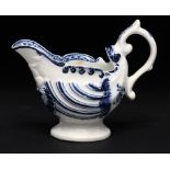 A DERBY BLUE AND WHITE DOLPHIN EWER CREAM BOAT, C1770 9cm h, painted with a flower to either side of
