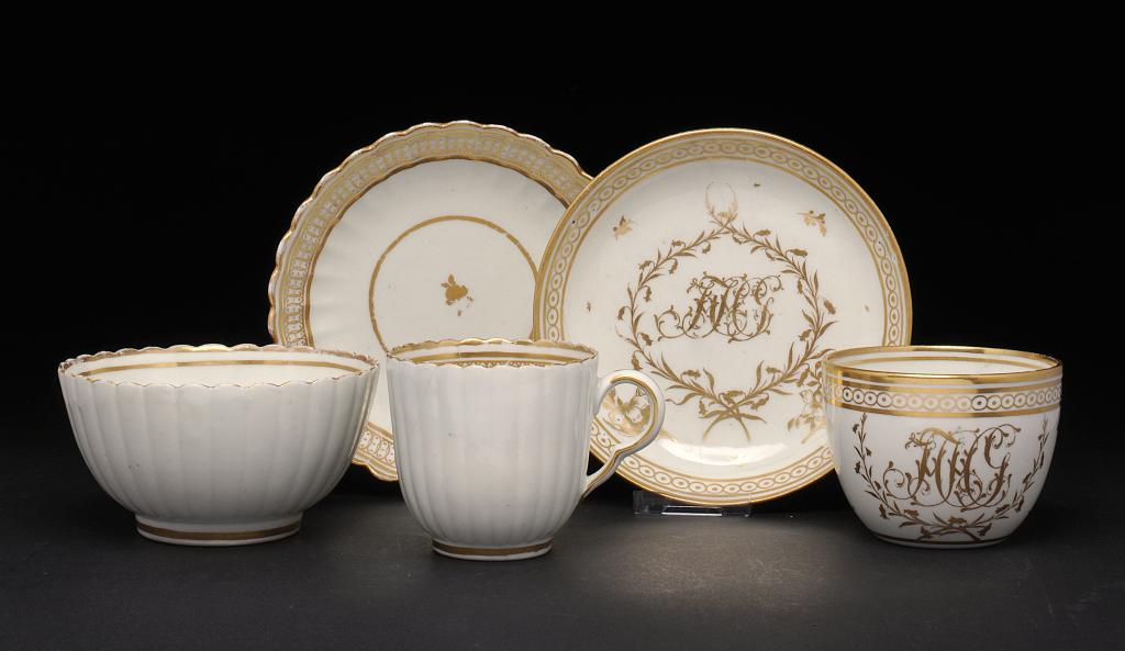 A CAUGHLEY FINELY GILT MONOGRAMMED TEA CUP AND SAUCER, A VB FLUTED GILT COFFEE CUP AND SAUCER AND