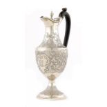 A GEORGE III SILVER LIDDED JUG later chased, 29cm h, maker TH in script, London 1787, 17ozs
