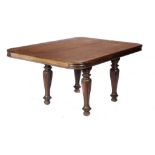 AN ANGLO INDIAN ROSEWOOD DINING TABLE, MID 19TH C on lappet carved legs and bulbous feet, 74cm h;
