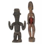 TRIBAL ART. TWO YUROBA CARVED WOOD FIGURES, EARLY 20TH C 32.5 and 39cm h Provenance: Acquired by the