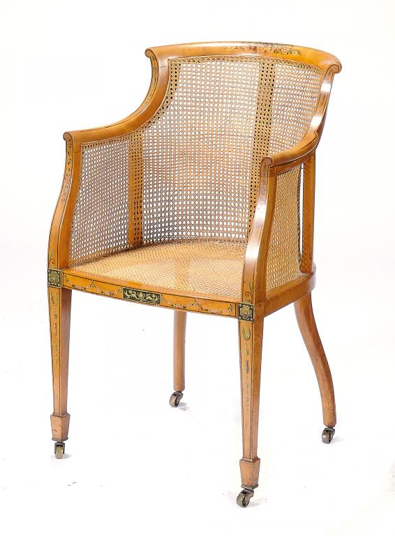 A PAINTED SATINWOOD AND CANED BERGÈRE, EARLY 20TH C 89cm h ++Painted decoration worn on the arms,
