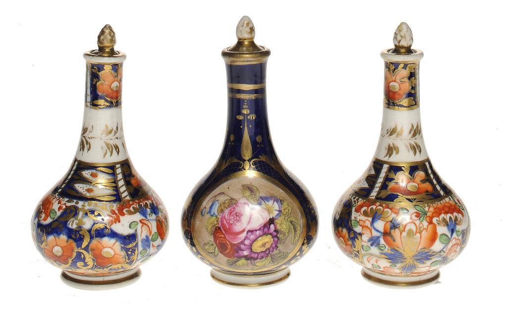ONE AND A PAIR OF DERBY COBALT GROUND SCENT BOTTLES AND STOPPERS C1820 10cm h, red printed or
