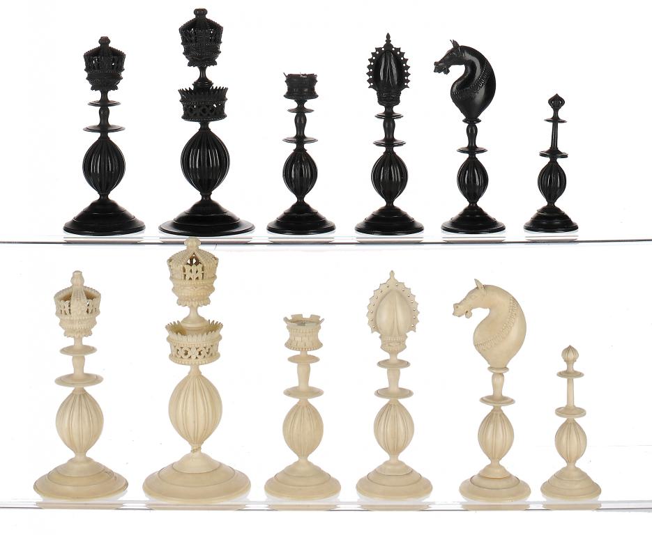 AN INDIAN IVORY CHESS SET, DELHI, C1820-40 stained black and natural, kings 11cm h ++Base of white