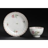 A CAUGHLEY POLYCHROME TEA BOWL AND MATCHING FLUTED SAUCER, C1792-95 in the Pink Gillyflowers