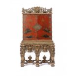 A WILLIAM III SCARLET JAPANNED CABINET ON STAND, LATE 17TH C the interior fitted with drawers,