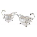 TWO SIMILAR GEORGE III SILVER SAUCE BOATS 15.5 and 16.5cm l, by Hester Bateman, London 1783 and