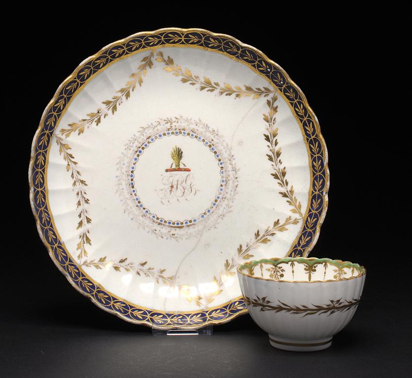 A CAUGHLEY CRESTED SAUCER DISH AND REEDED TEA BOWL, C1788-93 the tea bowl in the Green and Gold