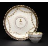 A CAUGHLEY CRESTED SAUCER DISH AND REEDED TEA BOWL, C1788-93 the tea bowl in the Green and Gold