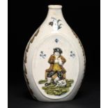 A PRATTWARE FLASK, C1810 moulded to either side with a man seated on a barrel, a glass and pipe or