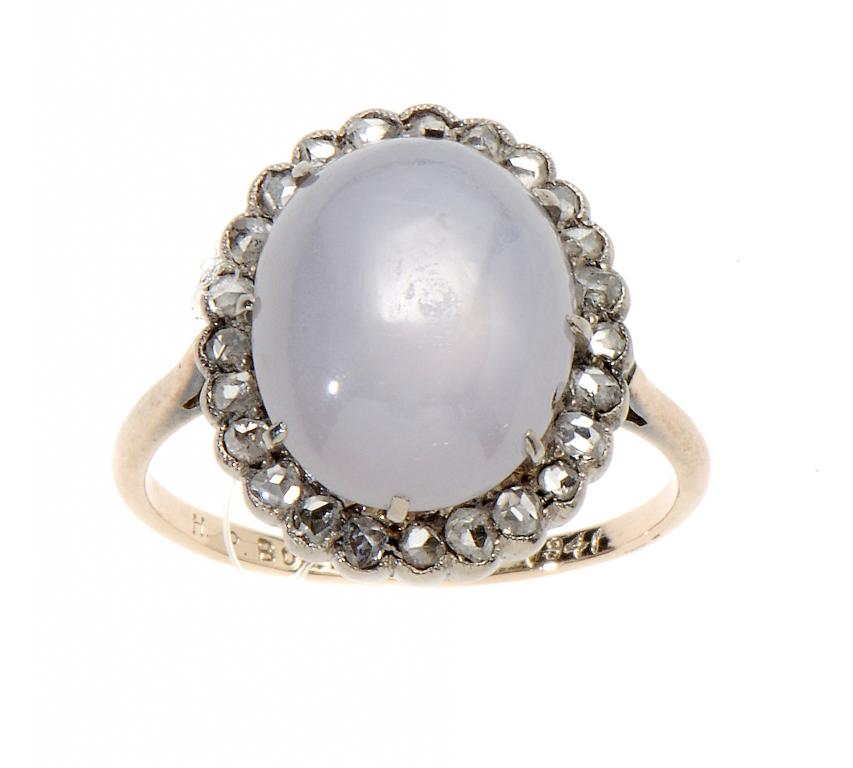 A MOONSTONE AND DIAMOND CLUSTER RING, C1900 gold hoop engraved H P Bull 1856-1941, size I ++