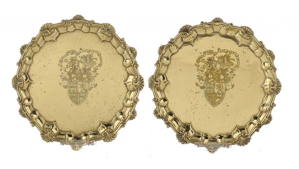 A PAIR OF ENGLISH BRASS SILVER SHAPED WAITERS later engraved with armorials, 20cm diam