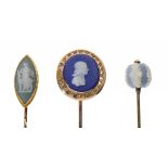 TWO GOLD STICK PINS SET WITH WEDGWOOD CAMEOS, LATE 19TH C one of John Wesley, and another stick