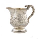 A GEORGE IV SILVER REPOUSSÉ CREAM JUG with serpent handle, 10cm h, by John Lias & Sons, London 1826,