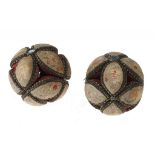 A PAIR OF EMBROIDERED SILK PIN CUSHIONS IN THE FORM OF A BALL, 19TH C composed of 12 navette
