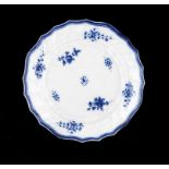 A CAUGHLEY BLUE AND WHITE TOURNAI SHAPED PLATE, C1790 painted with the Salopian Sprigs pattern, 21cm