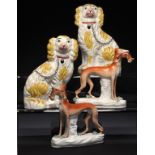 A PAIR OF STAFFORDSHIRE EARTHENWARE MODELS OF SPANIELS AND A PAIR OF GREYHOUNDS, C1870 spaniels 23cm