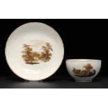 A PINXTON TEA BOWL AND SAUCER, 1796-1813 painted with landscapes, saucer 13.5cm diam ++Tea bowl in