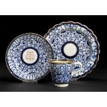 A CAUGHLEY BLUE AND WHITE PLATE AND MATCHING SAUCER AND BELL SHAPED CUP, C1788-93 painted with the