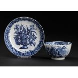 A CALCUT BLUE AND WHITE TEA BOWL AND MATCHED SAUCER, C1794-96 printed with the Vase of Flowers