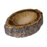 A NORTHERN EUROPEAN MARBLE STOUP, PROBABLY MEDIEVAL of rough hewn shaped oval form, 25cm w ++No