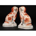 A PAIR OF STAFFORDSHIRE EARTHENWARE MODELS OF 'DOLEFUL' SPANIELS, C1850 22cm h ++Both in fine
