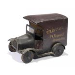 A TINPLATE SHOPKEEPER'S MODEL DELIVERY VAN, C1920 the body painted in reddish brown to resemble wood