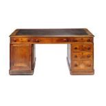 A VICTORIAN MAHOGANY DESK, C1880 fitted with nine drawers to one side and a pair of panelled doors