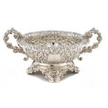 A VICTORIAN SILVER PROFUSELY EMBOSSED TWO HANDLED OVAL CENTREPIECE 52cm w, by Horace Woodward & Co