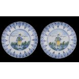 A PAIR OF DUTCH POLYCHROME TIN GLAZED EARTHENWARE PLATES, LATE 19TH C printed with a swordsman and