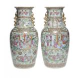 A PAIR OF CANTON FAMILLE ROSE VASES, 19TH C with pleated neck, 46cm h ++Both in fine condition