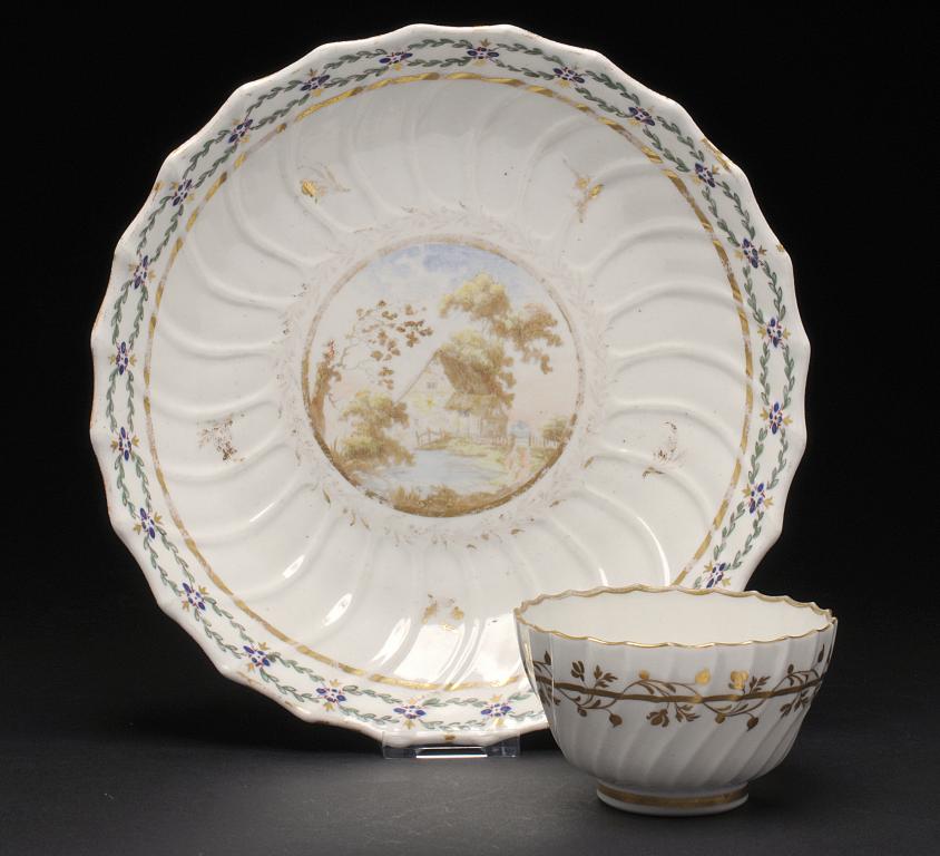 A CAUGHLEY POLYCHROME SHANKED SAUCER DISH AND A SIMILAR CAUGHLEY TEA BOWL, C1788-93 enamelled with