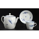 A CAUGHLEY BLUE AND WHITE BARREL SHAPED TEAPOT AND COVER AND A MATCHING CAUGHLEY CUP AND SAUCER,