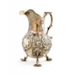 A VICTORIAN SILVER CREAM JUG the handle terminating in a dolphin, crested, 12cm h, by Daniel, John