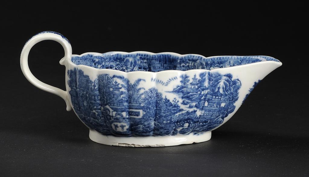 A CAUGHLEY BLUE AND WHITE FLUTED SAUCE BOAT, C1779-88, printed with the Full Nankin pattern, 21.