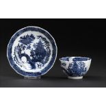 A CALCUT BLUE AND WHITE FLUTED TEA BOWL AND SAUCER, C1794-96 printed with the Round Arched Bridge