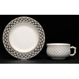 A SÈVRES RETICULATED CUP AND SAUCER, 1897 AND 1900 saucer 14.5cm diam, incised letters and