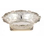 AN ELIZABETH II SILVER SAW PIERCED FRUIT BOWL with applied grapevine rim, 28cm diam, by Walker &