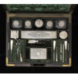 A VICTORIAN SILVER-FITTED ROSEWOOD DRESSING CASE with flush brass mounts and folding handles, 33cm