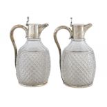 A PAIR OF VICTORIAN SILVER MOUNTED CUT GLASS CLARET JUGS, 23cm h, by Plante & Co, Birmingham
