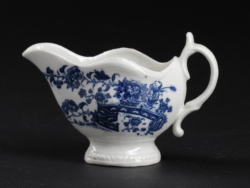 A CAUGHLEY BLUE AND WHITE CREAM BOAT, C1779-88 printed with the Fence pattern, 19.5cm l, printed